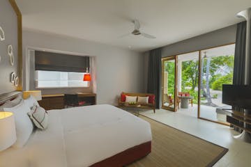 Bed view - Deluxe Beach bungalow, Dhigali Maldives